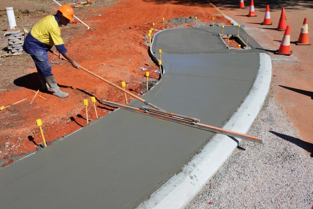 Experts construct and finish a curved concrete path for safe access Experts construct and finish a curved concrete path for safe access