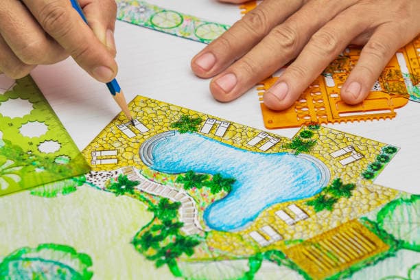 A landscape designer planning a poolside area with greenery and pathways A landscape designer planning a poolside area with greenery and pathways