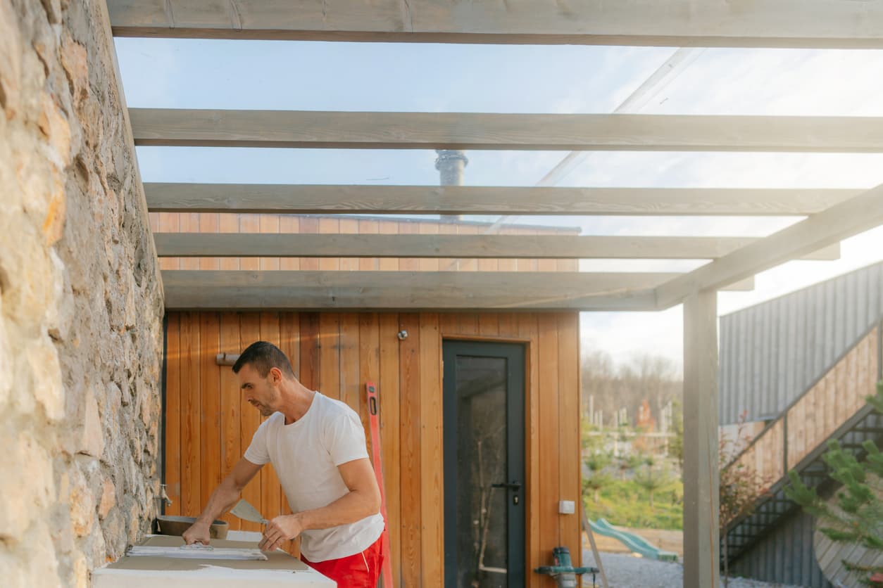Contractor building custom outdoor kitchen under pergola roof Contractor building custom outdoor kitchen under pergola roof