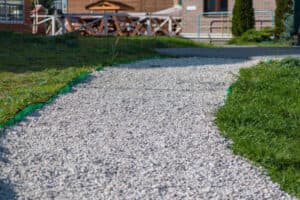 Completed gravel pathway installed with neatly laid stones Completed gravel pathway installed with neatly laid stones