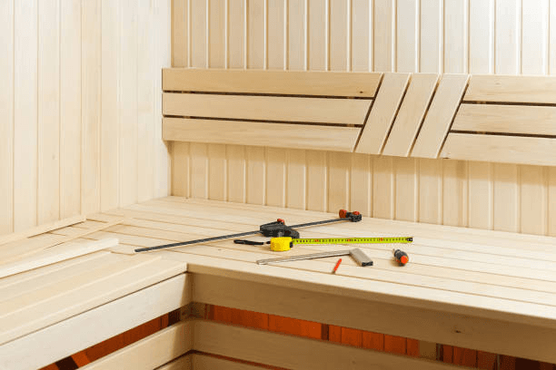 Wooden built-in seating partially installed with tools on the bench Wooden built-in seating partially installed with tools on the bench