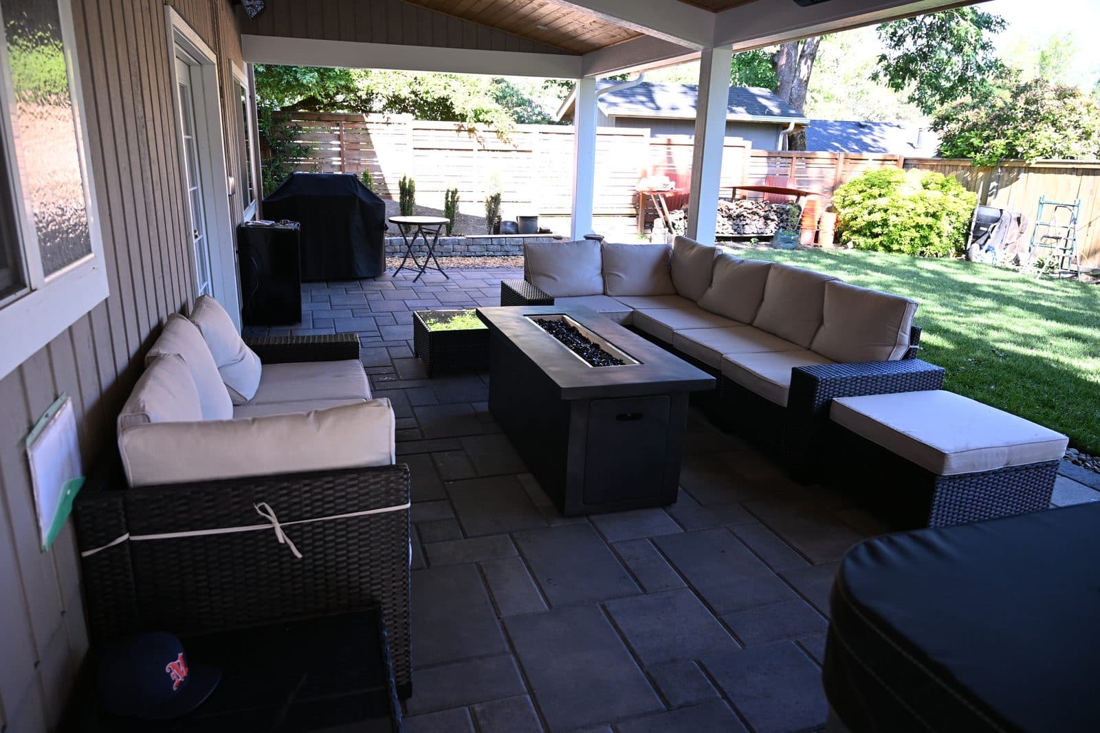 Covered patio with fire table and sectional seating built for everyday outdoor living Covered patio with fire table and sectional seating built for everyday outdoor living