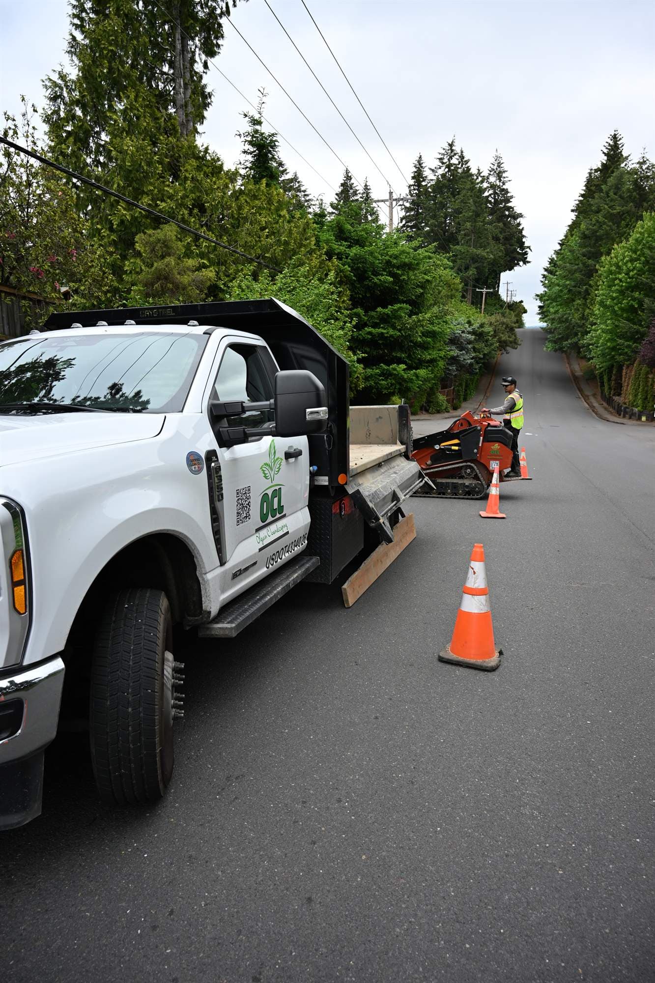 OCL crew loading equipment from the work truck at the start of a commercial route