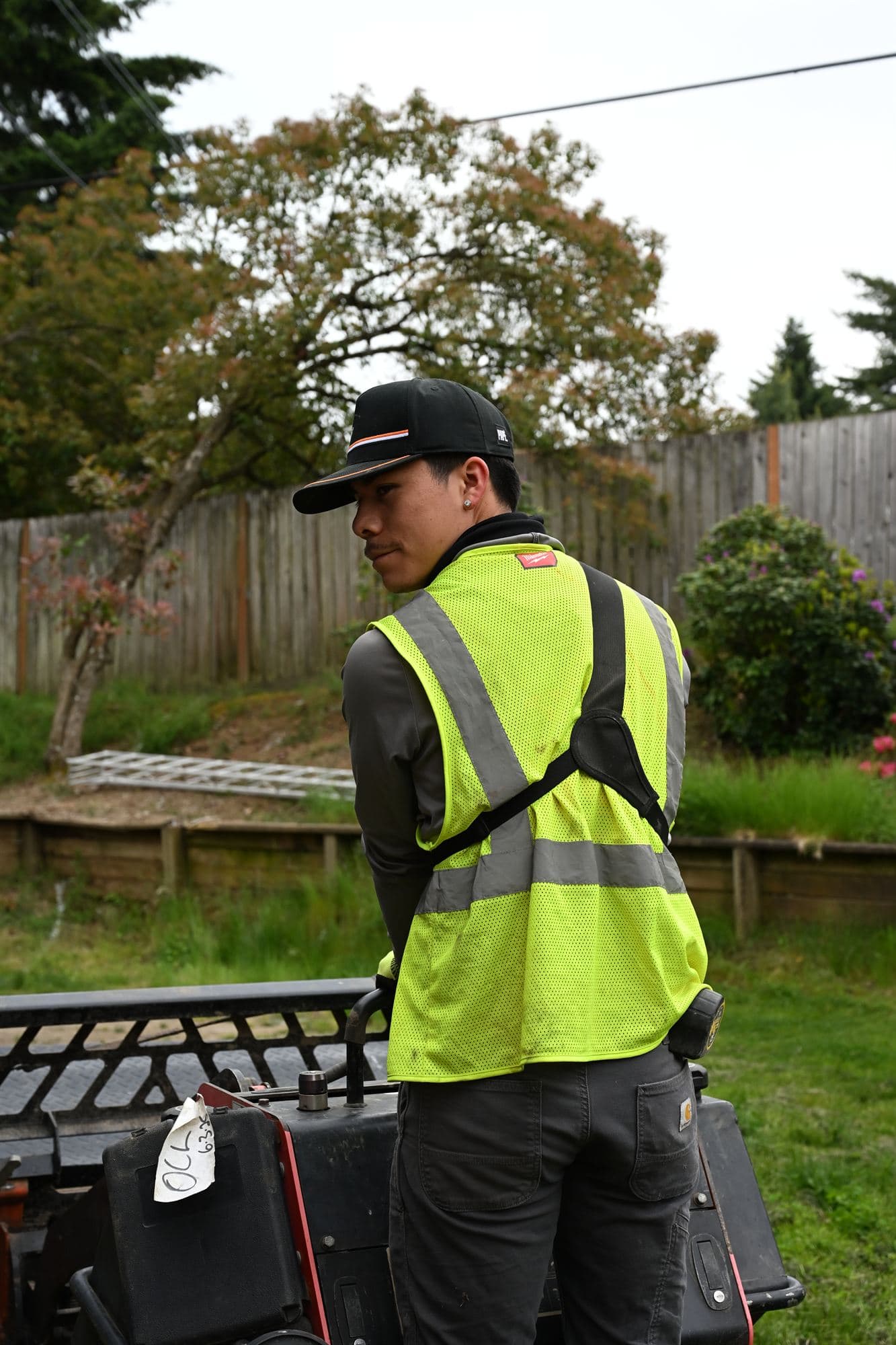 OCL technician working through an irrigation zone on a Portland Metro property