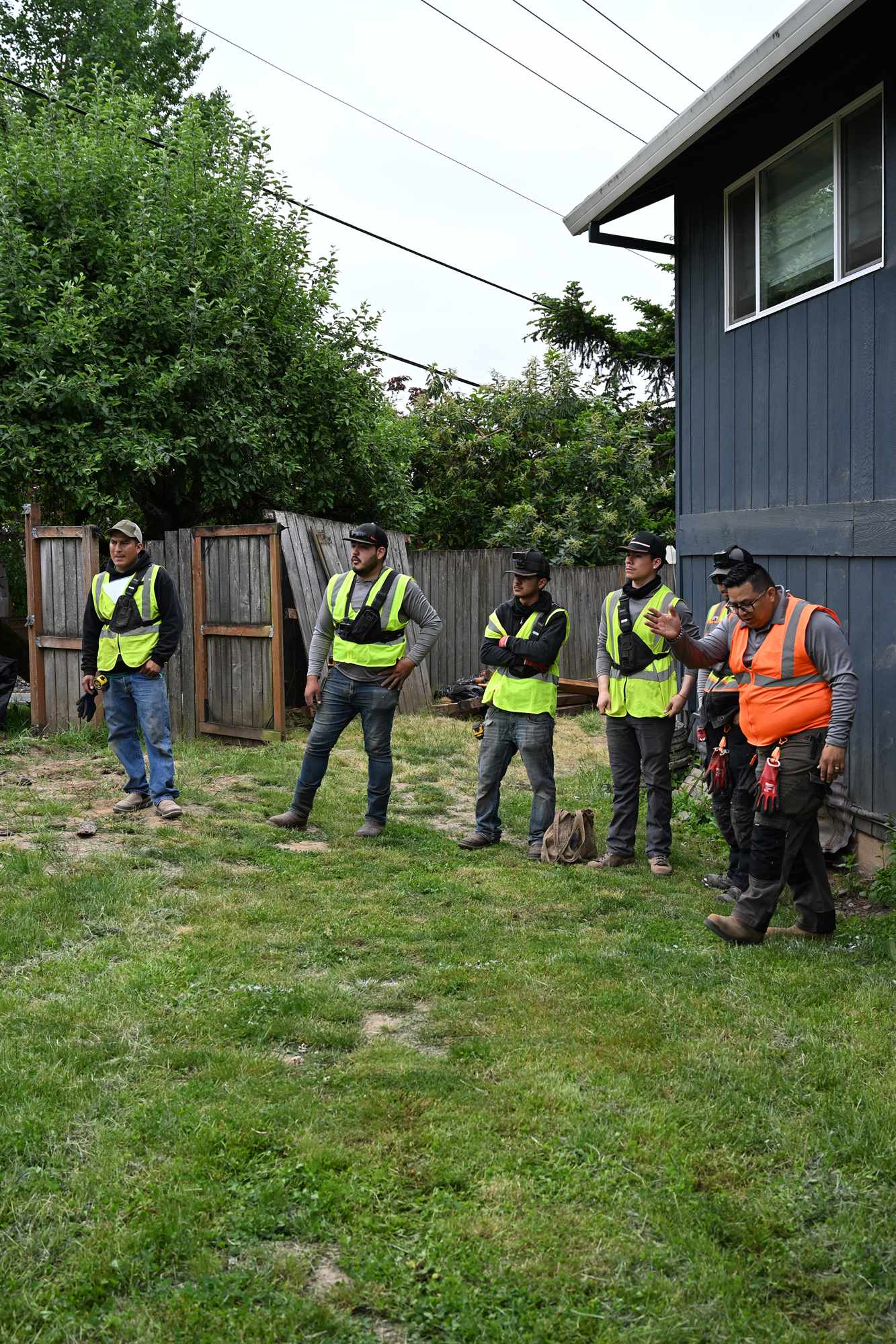 OCL technician diagnosing and repairing an irrigation zone, backflow certified service across the Portland Metro