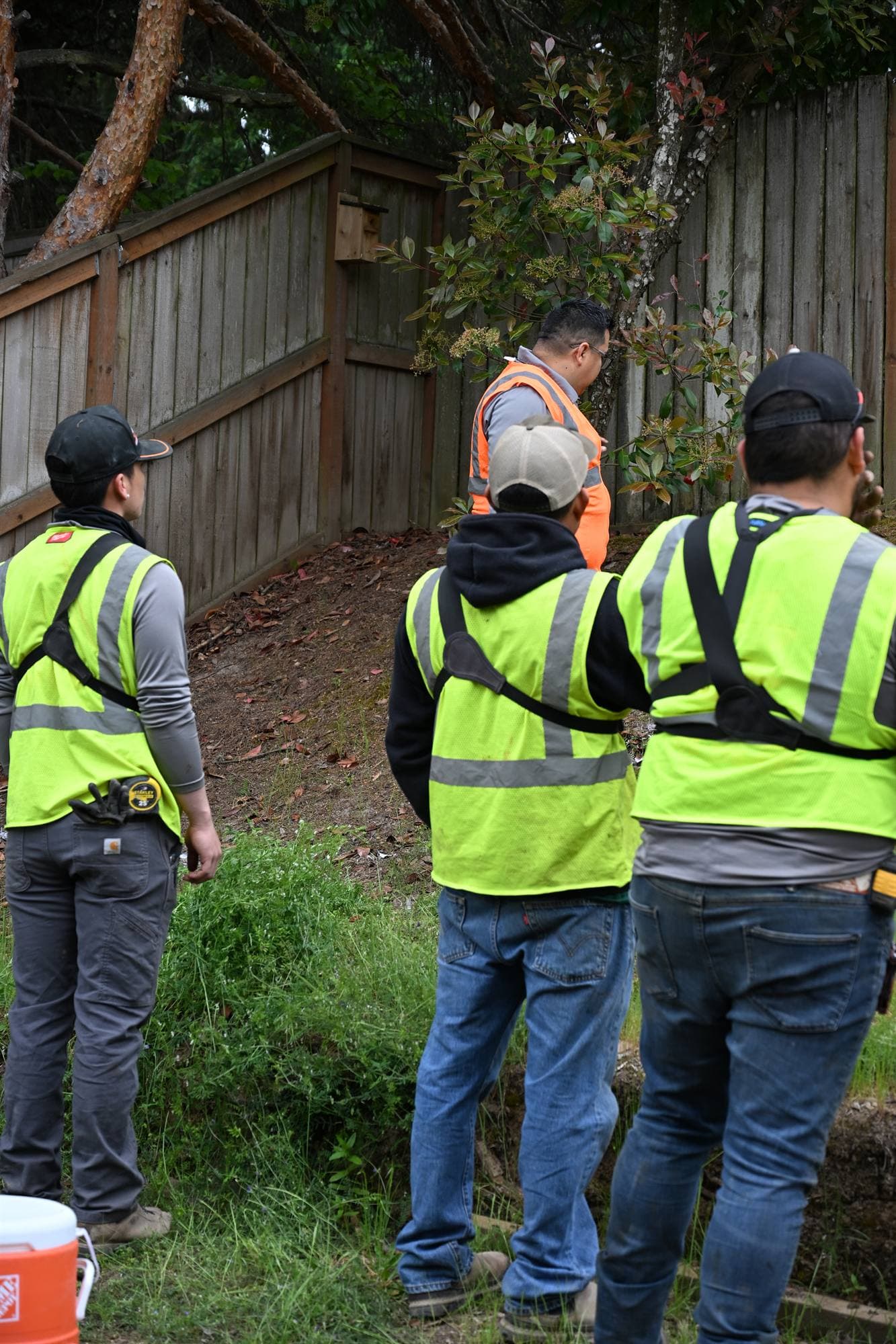 OCL crew in safety vests servicing a commercial property as a team