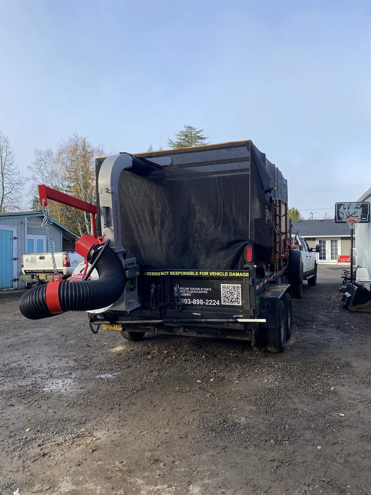 OCL leaf removal truck loaded during a fall clean-up on an Oregon residential street