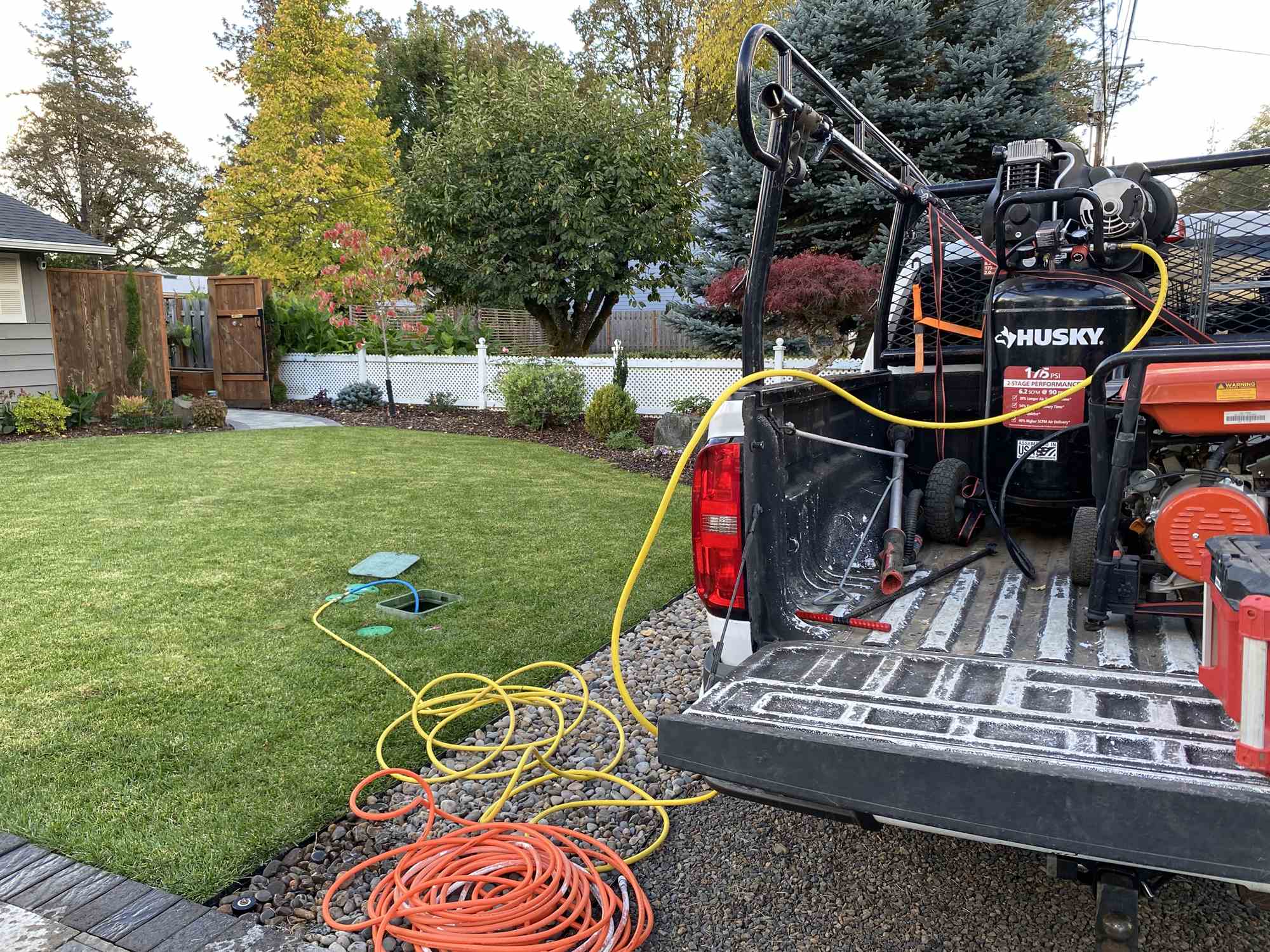 Pressure washing rig staged for spring hardscape cleaning