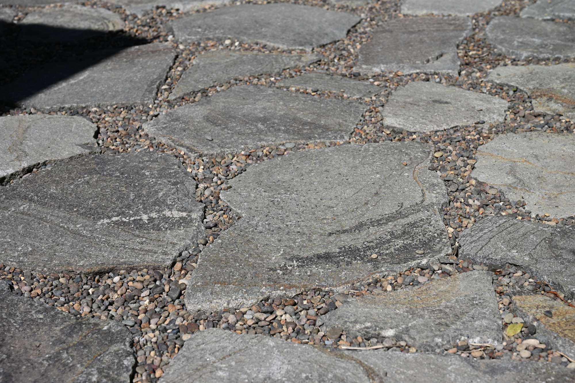 Irregular flagstone patio detail with tight gravel joints
