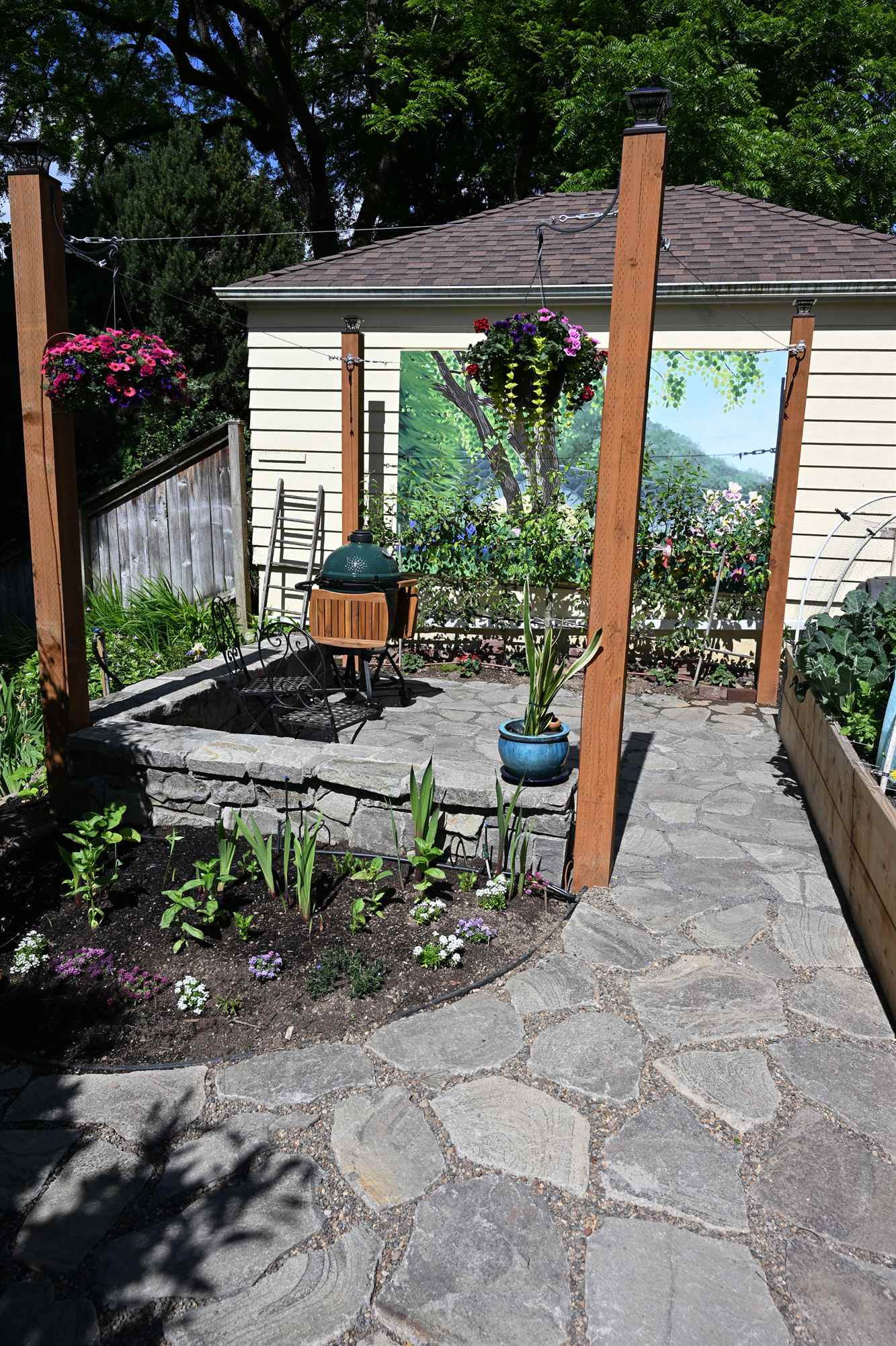 Tended garden patio and raised beds during a maintenance visit